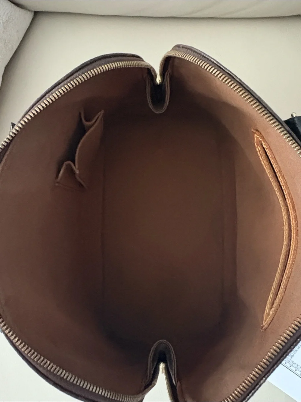 Louis Vuitton Monogram Canvas Alma in Brown with Black Trim